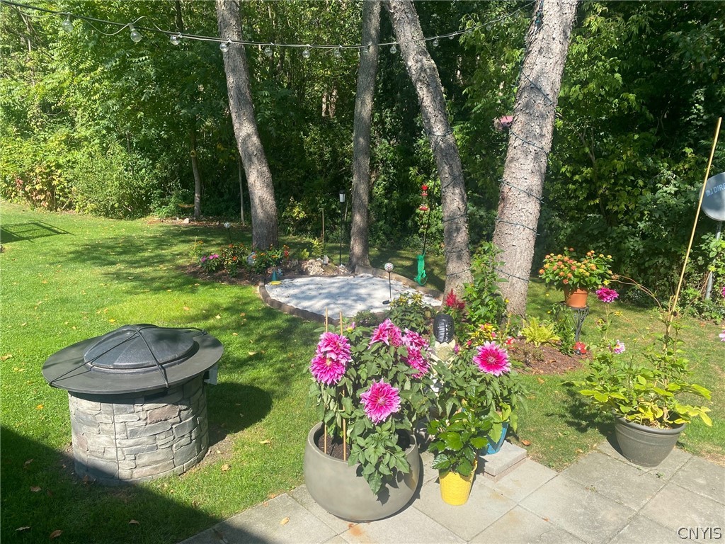 8245 Kirkville Road Manlius, NY 13082 - Photo 48 of 50 Fire pit and landscaping throughout.