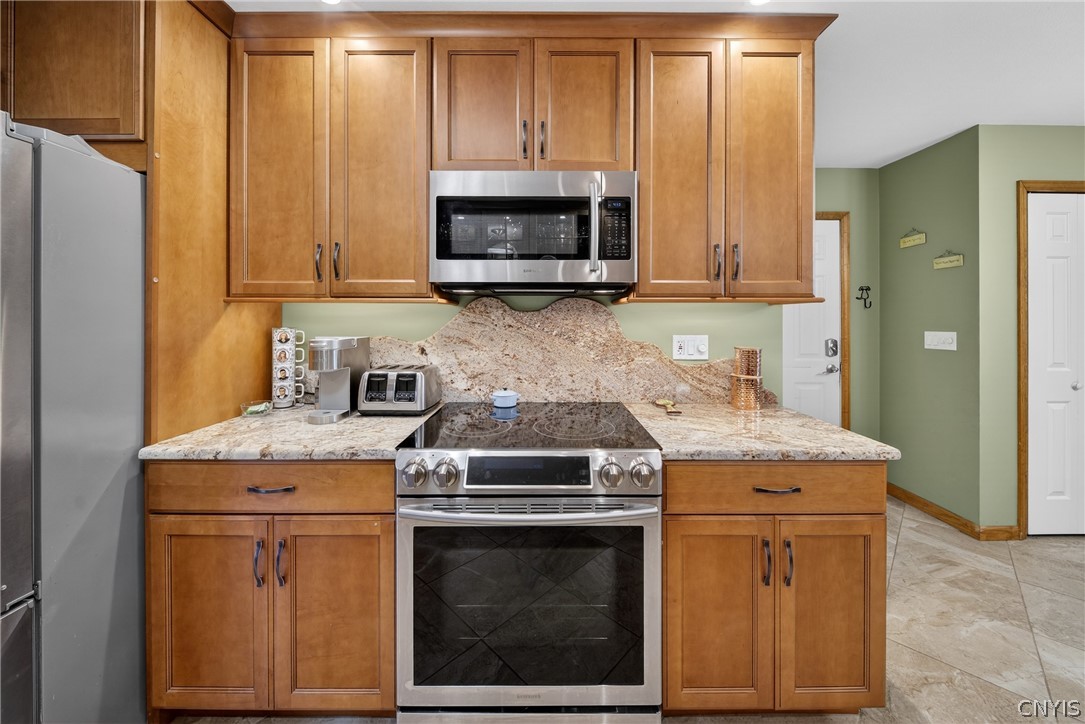 8245 Kirkville Road Manlius, NY 13082 - Photo 10 of 50 Sleek, stainless steel appliances enhance the tone