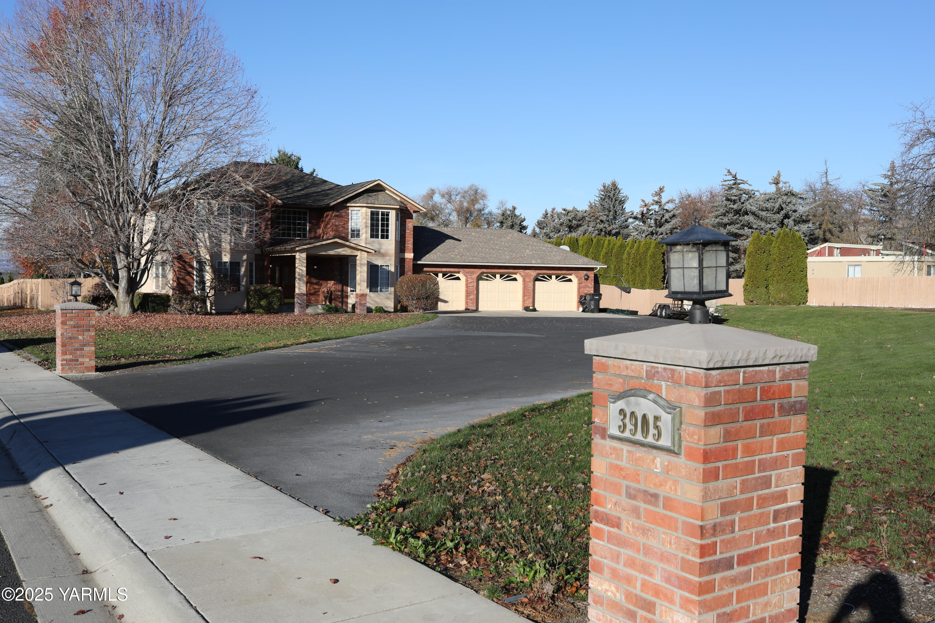 a front view of a residential apartment building with a yard