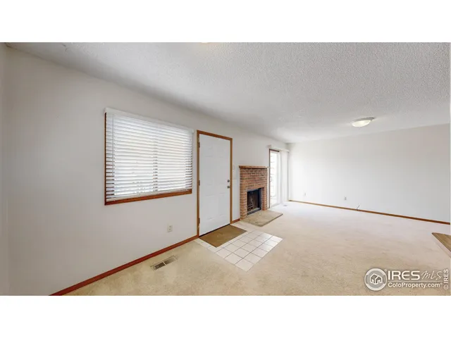 a open living room with a fireplace