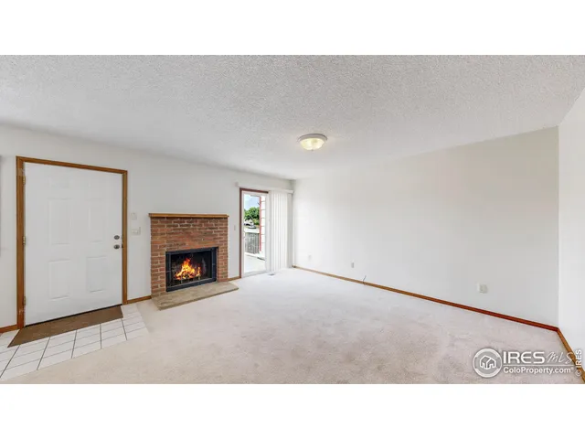 a room with furniture and a fireplace