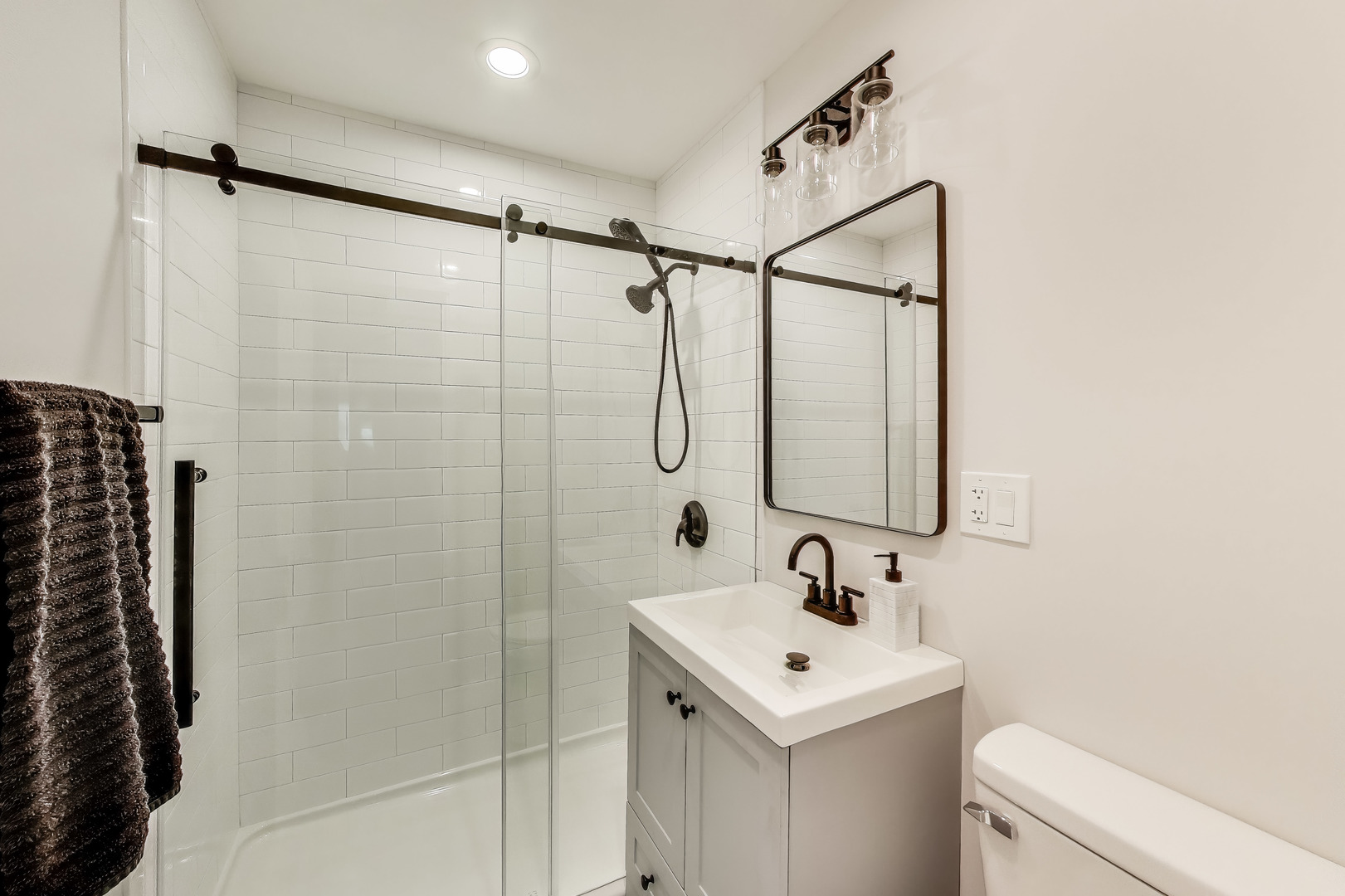 3205 Meadow Drive Rolling Meadows, IL 60008 - Photo 11 of 35 a bathroom with a sink a toilet and shower