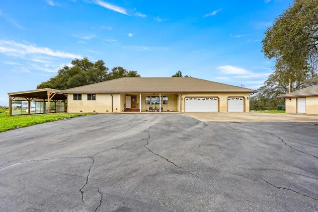 a dining room with furniture and a kitchen view