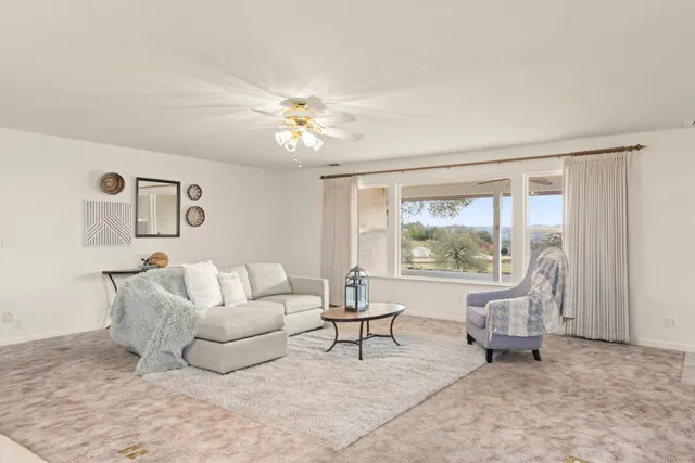 a bedroom with a bed and a chair