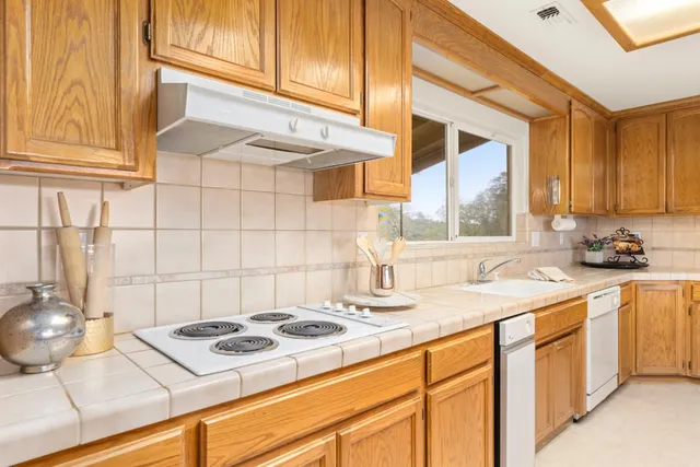 a bathroom with a sink a mirror and a shower