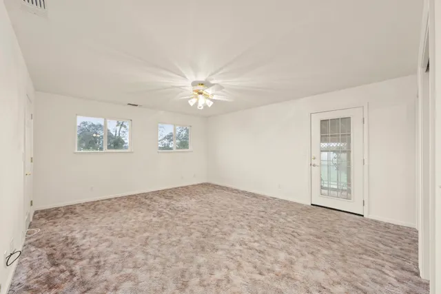 a view of a park with large trees