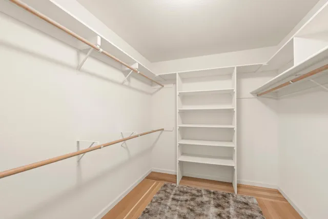 a house with green field in front of it