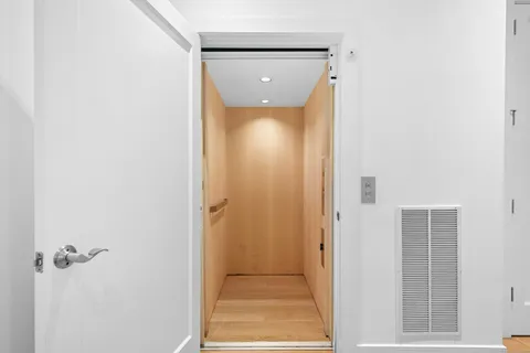 a view of a hallway with front door