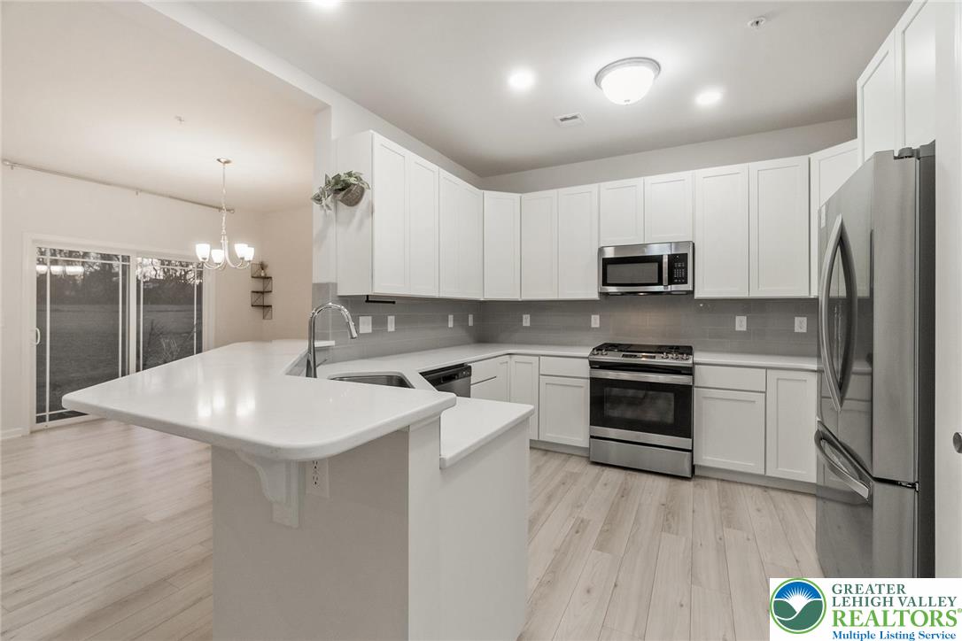 164 Maureen Lane Allentown, PA 18104 - Photo 12 of 28 a kitchen with a sink a stove a refrigerator and a stove