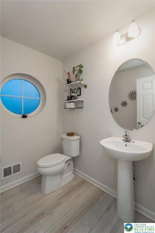 164 Maureen Lane Allentown, PA 18104 - Photo 13 of 28 a bathroom with a sink a toilet and a mirror