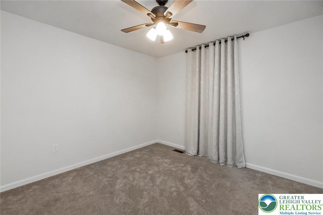 164 Maureen Lane Allentown, PA 18104 - Photo 19 of 28 an empty room with closet and a chandelier fan