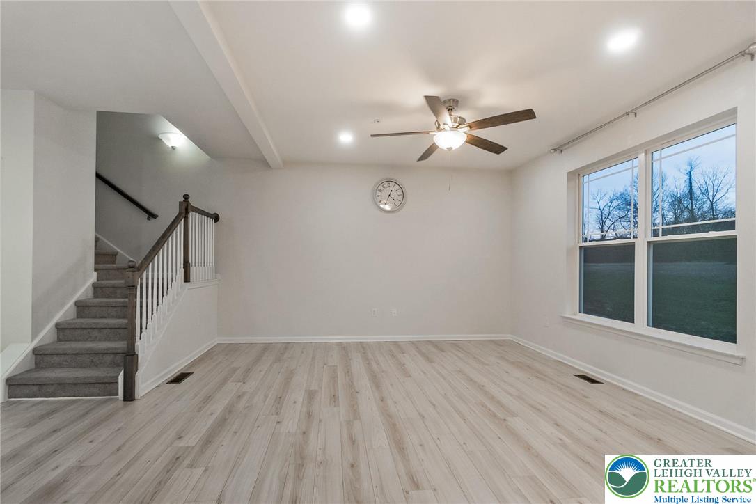 164 Maureen Lane Allentown, PA 18104 - Photo 8 of 28 a view of an empty room with wooden floor and a window