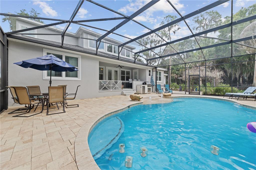 16948 Deer Island Road Tavares, FL 32778 - Photo 53 of 67 a view of swimming pool with outdoor seating