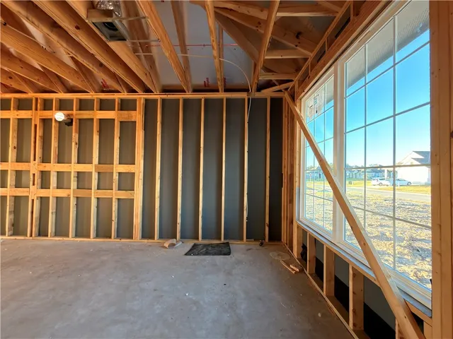 a view of an empty room with windows