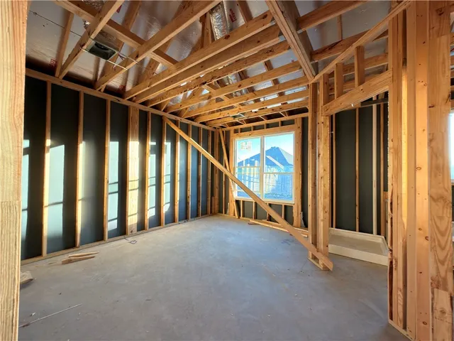 a bed room with a bed and a window