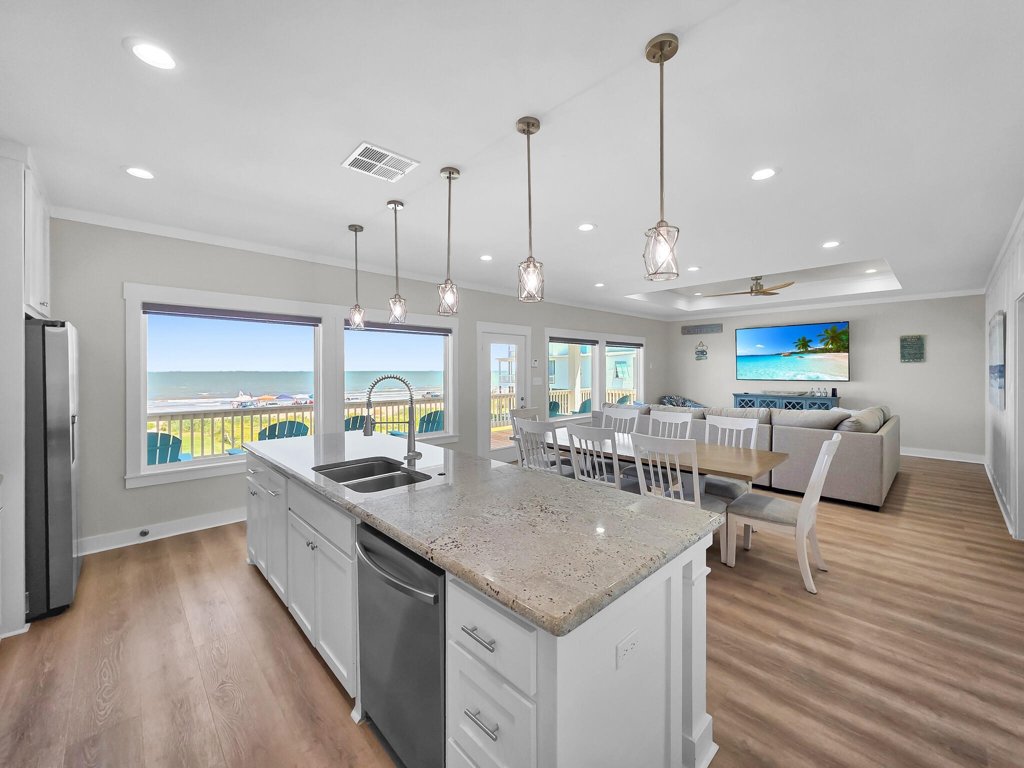 1215 Gulf Road Crystal Beach, TX 77650 - Photo 11 of 34 a kitchen with stainless steel appliances granite countertop a sink and kitchen island