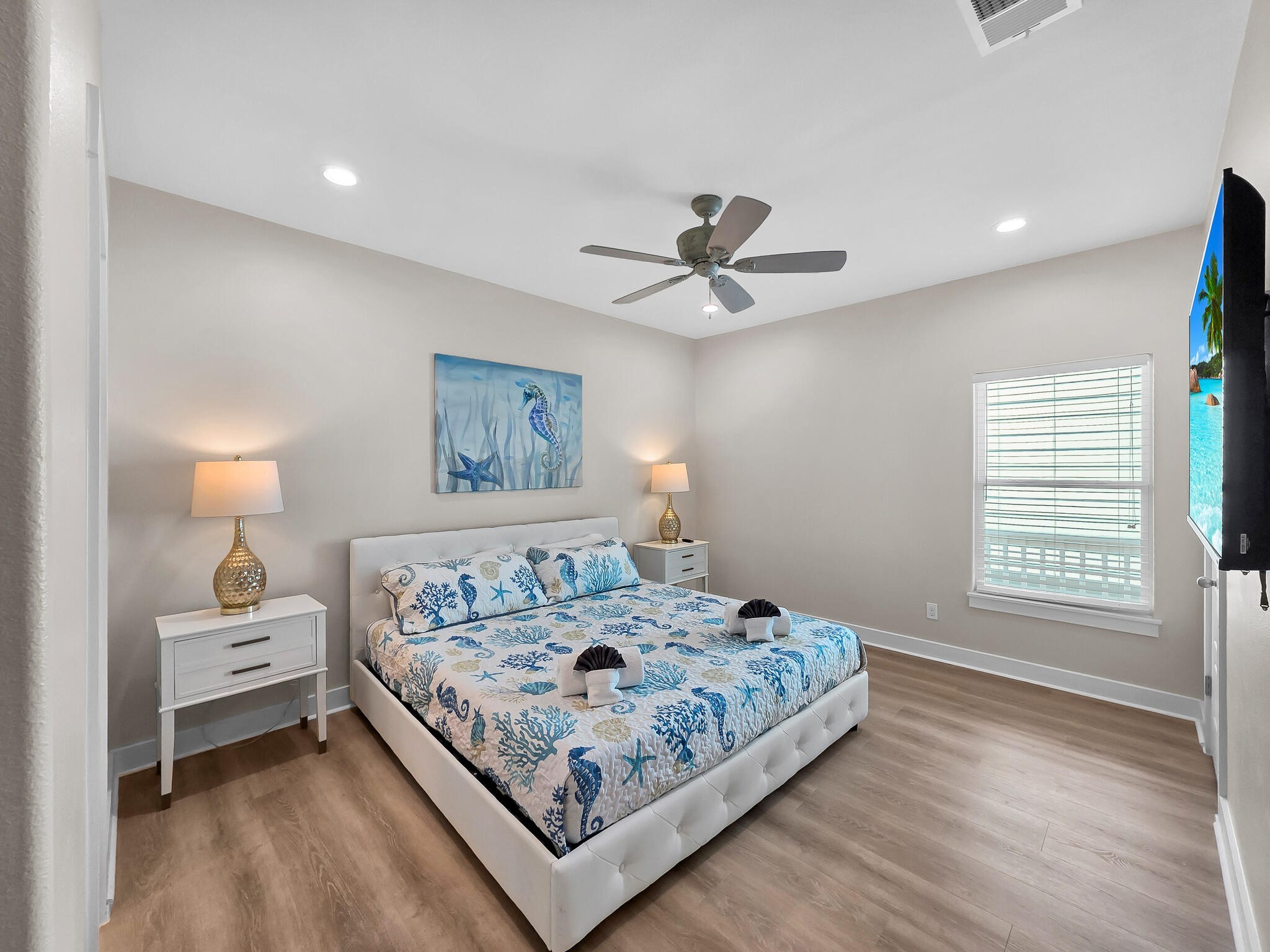 1215 Gulf Road Crystal Beach, TX 77650 - Photo 18 of 34 a bedroom with a large bed and a window