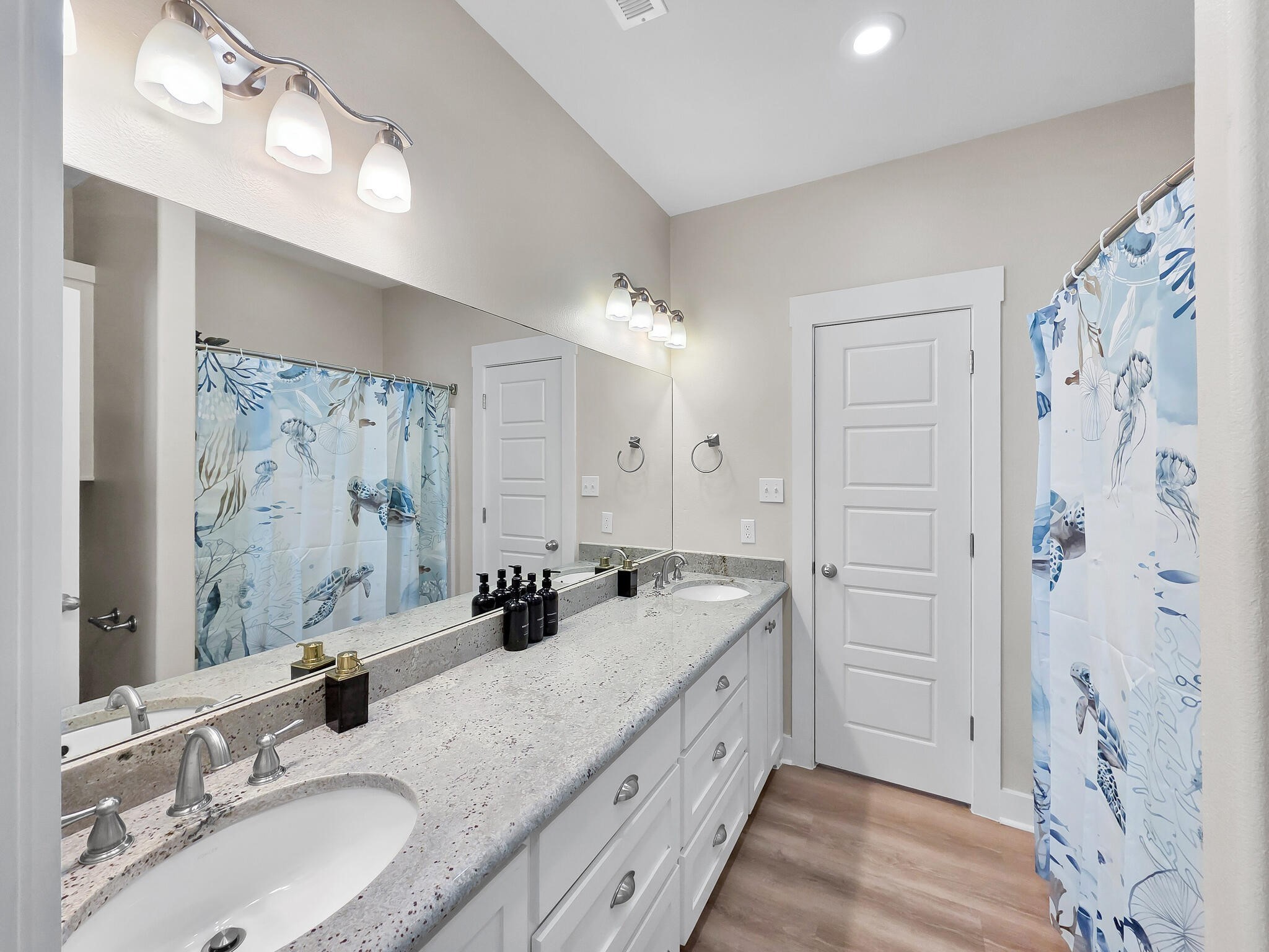 1215 Gulf Road Crystal Beach, TX 77650 - Photo 19 of 34 a bathroom with a double vanity sink mirror and double