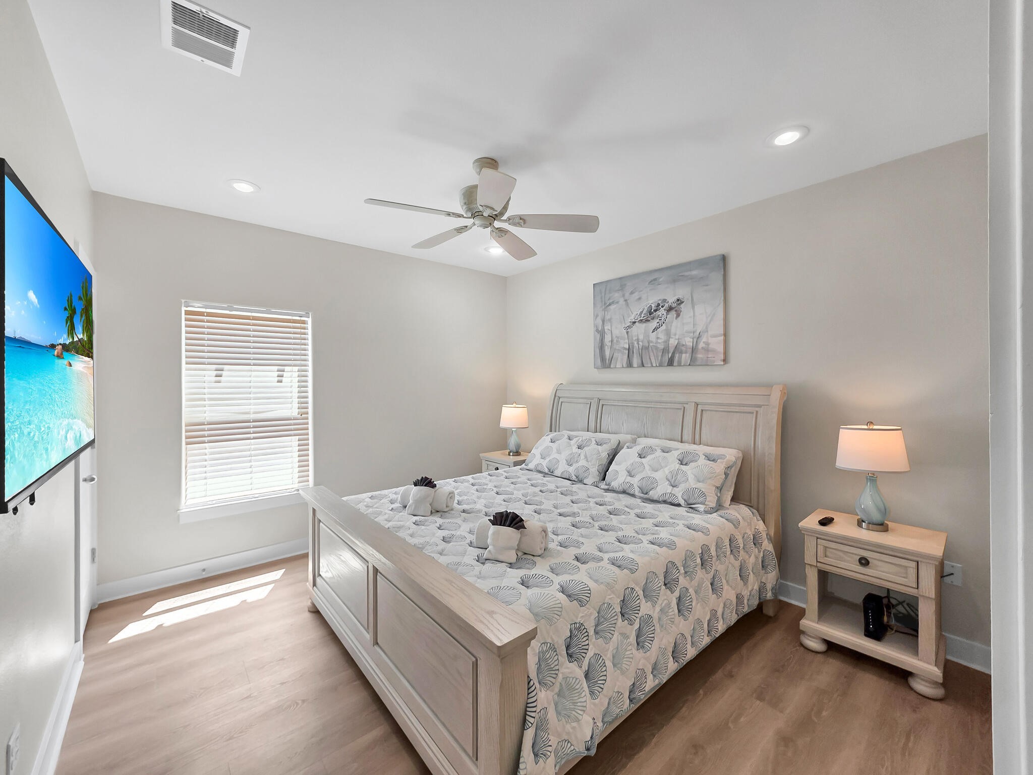 1215 Gulf Road Crystal Beach, TX 77650 - Photo 20 of 34 a bedroom with a bed and a window