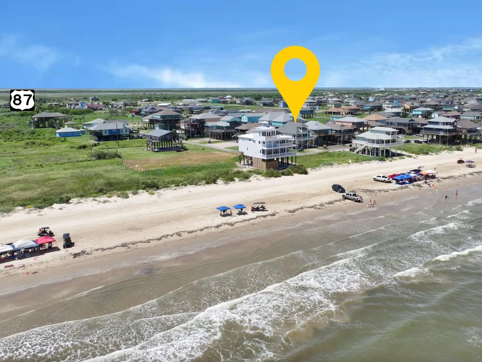 1215 Gulf Road Crystal Beach, TX 77650 - Photo 2 of 34 a view of a beach with a swimming pool