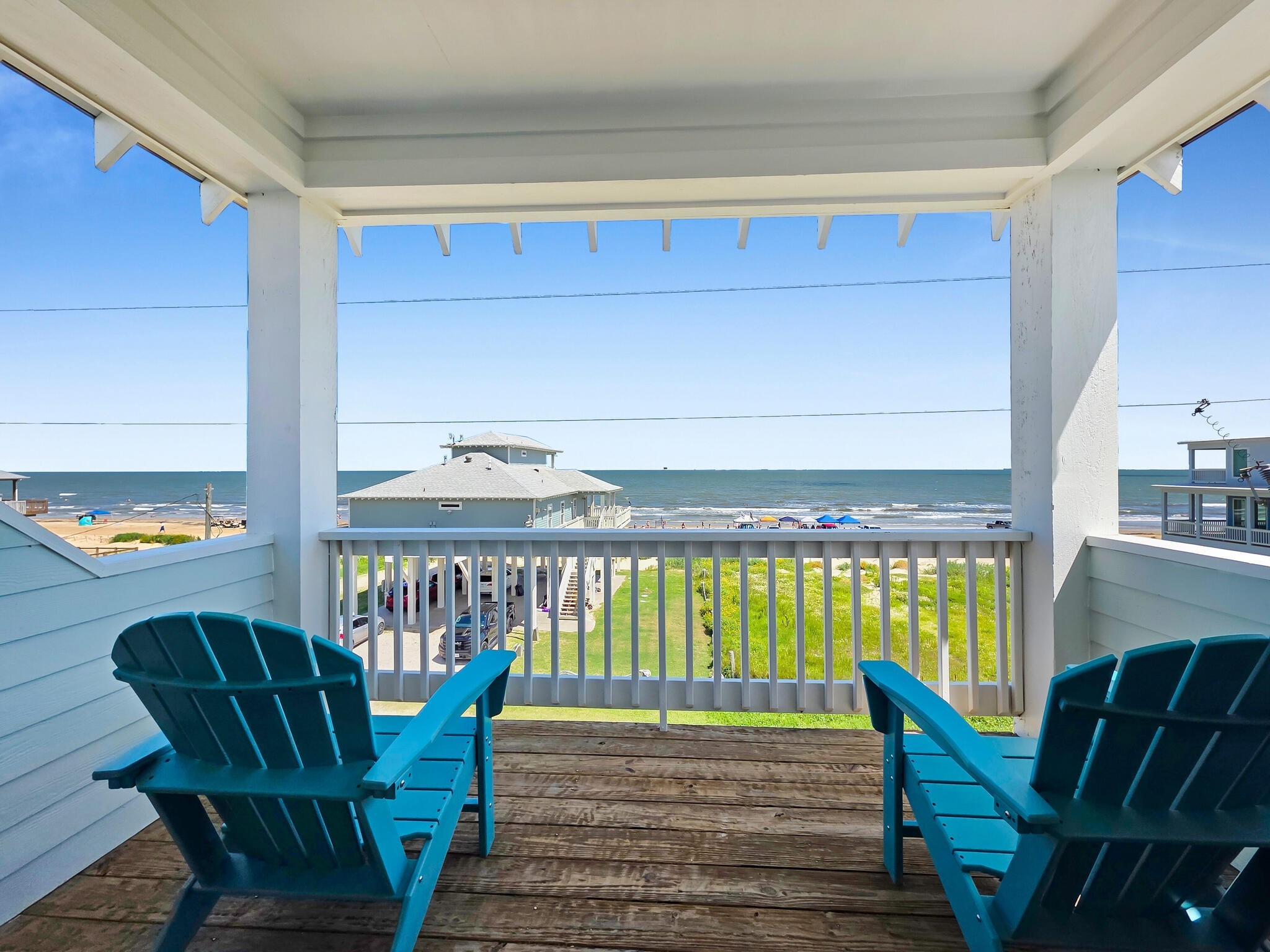 1215 Gulf Road Crystal Beach, TX 77650 - Photo 25 of 34 a view of a chairs and table in the balcony