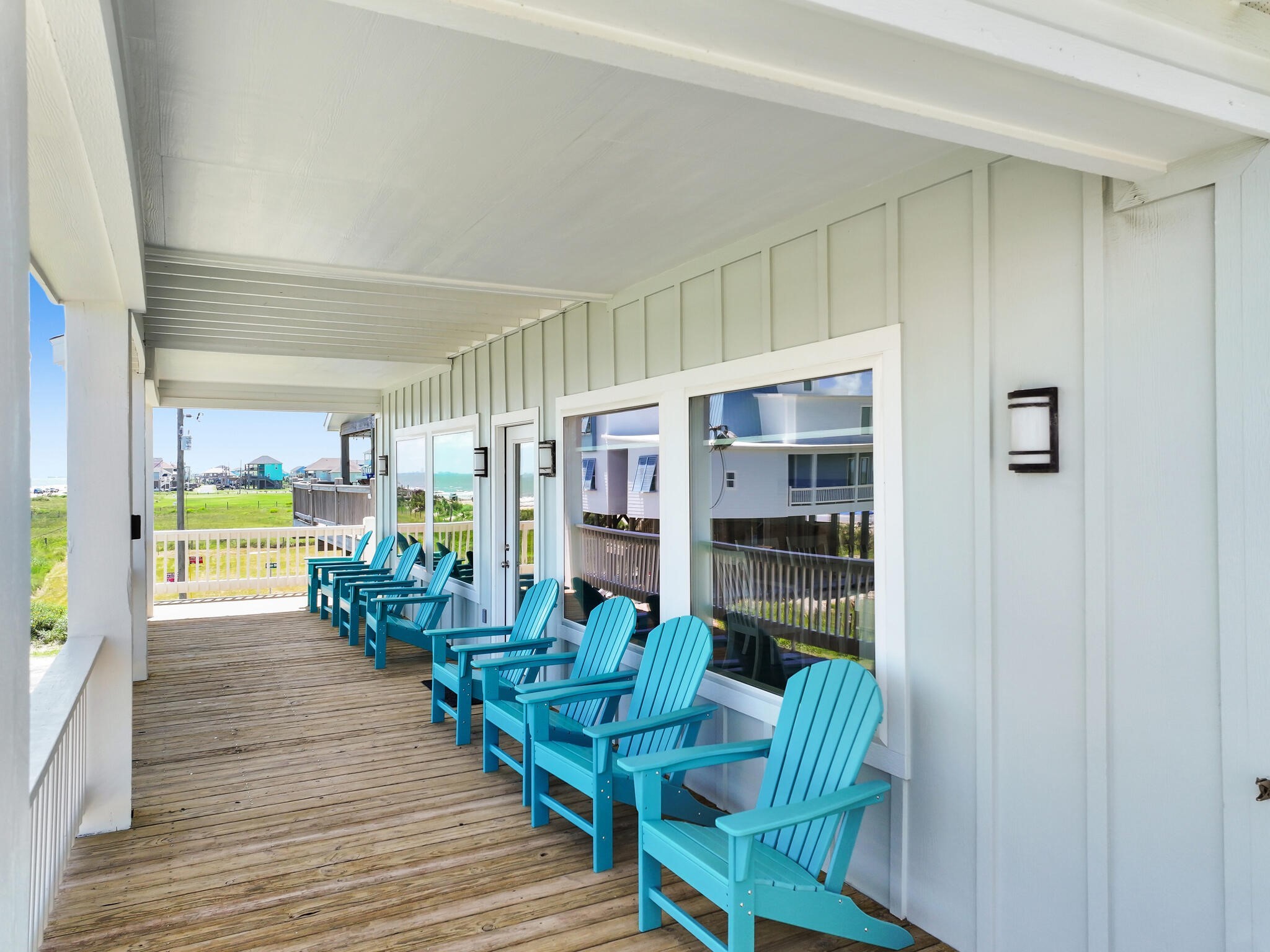 1215 Gulf Road Crystal Beach, TX 77650 - Photo 31 of 34 a view of a dining room with furniture window and wooden floor