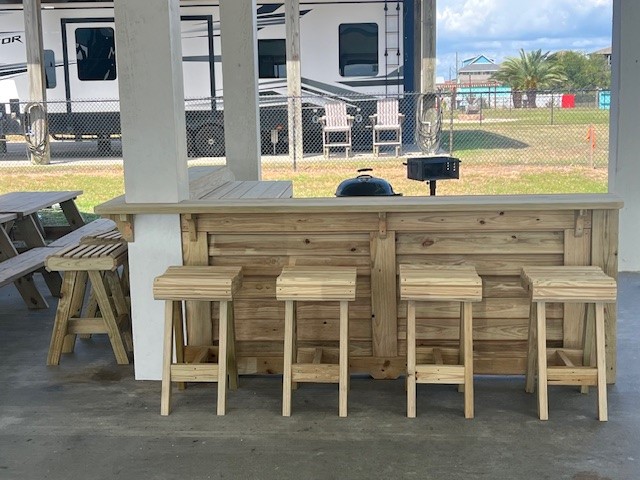 1215 Gulf Road Crystal Beach, TX 77650 - Photo 33 of 34 a view of a patio with a table and chairs