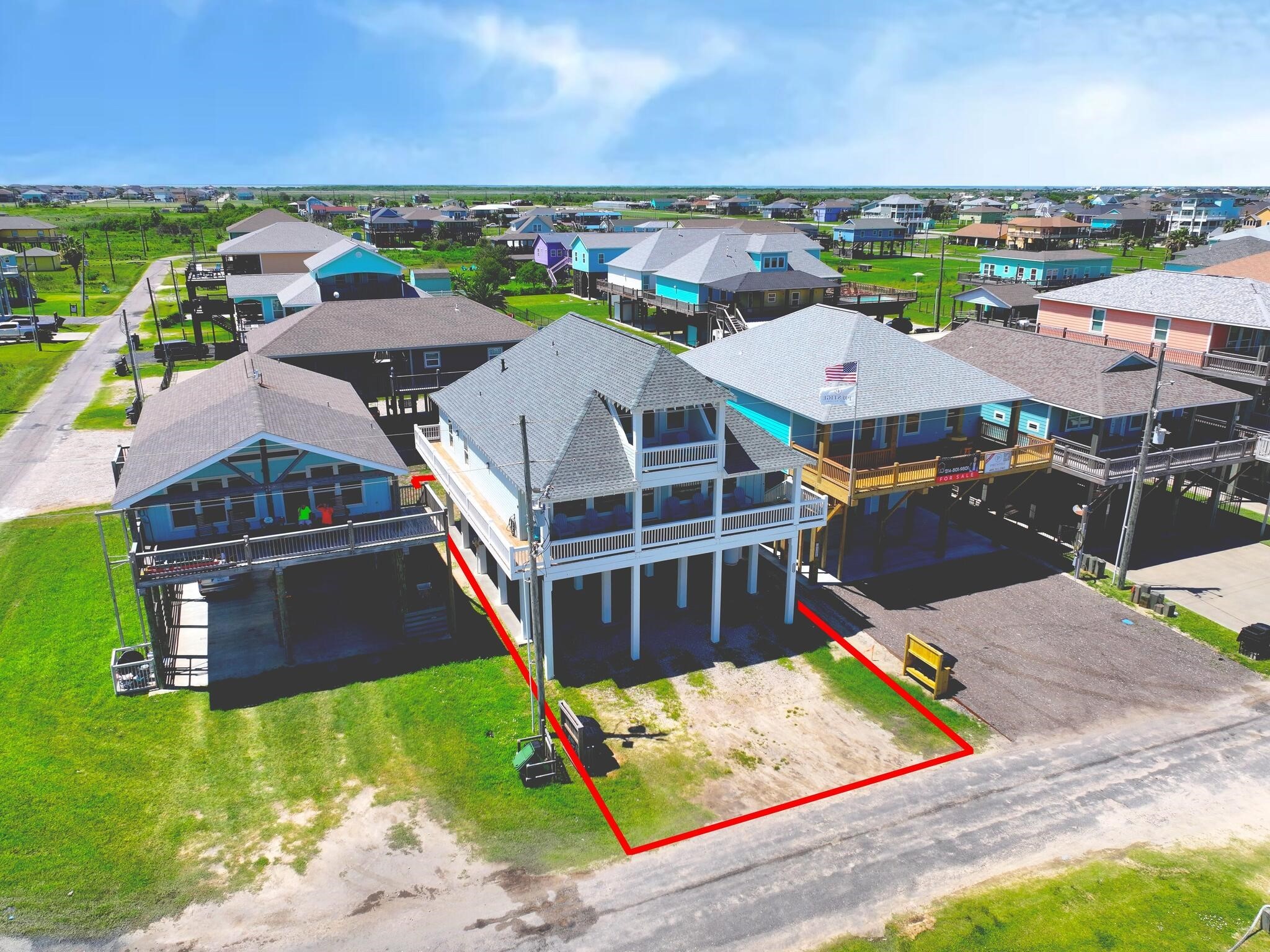 1215 Gulf Road Crystal Beach, TX 77650 - Photo 5 of 34 an aerial view of a house with a garden and lake view