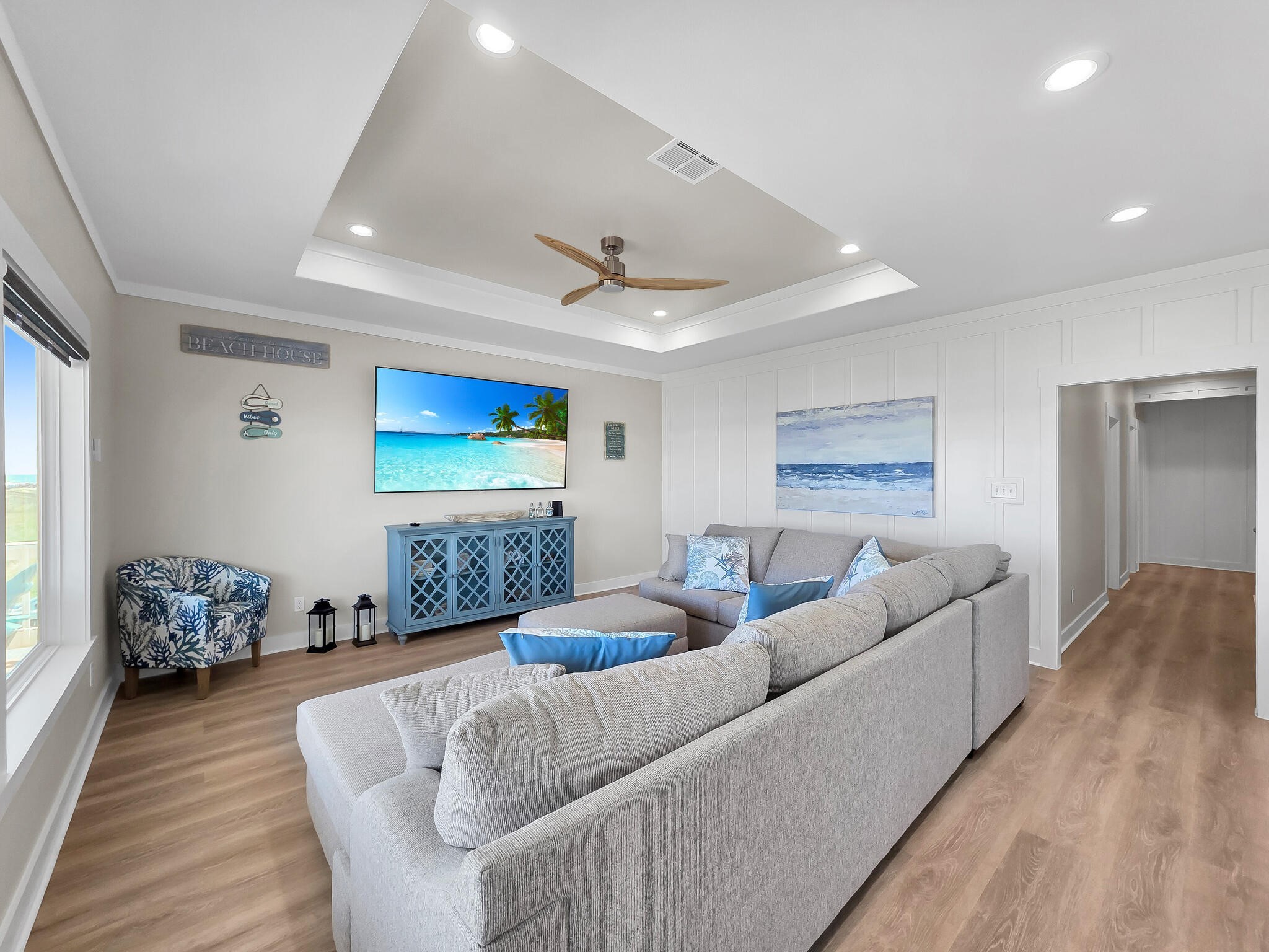1215 Gulf Road Crystal Beach, TX 77650 - Photo 8 of 34 a living room with furniture two window and a wooden floor