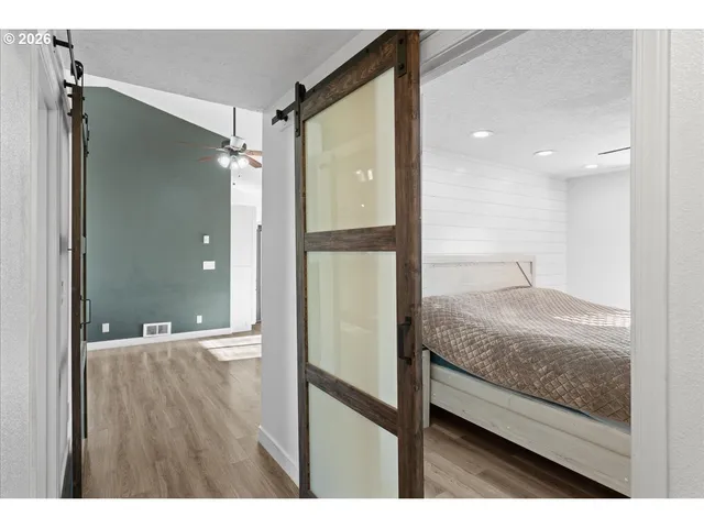 a bathroom with a granite countertop sink mirror and shower