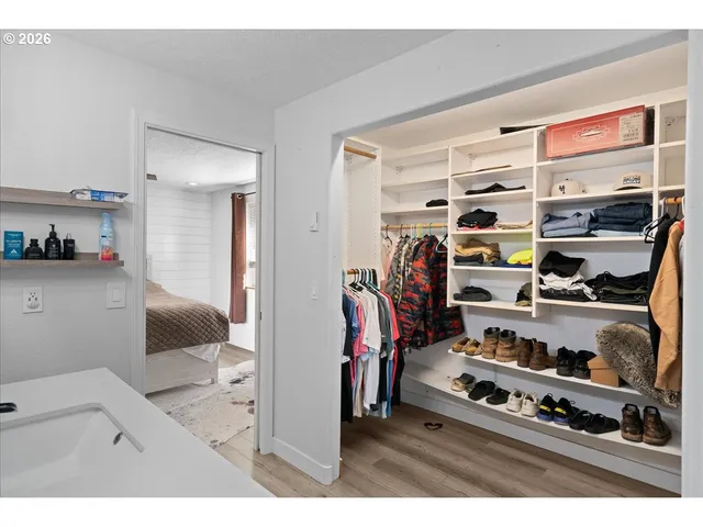 a bedroom with bed and a closet