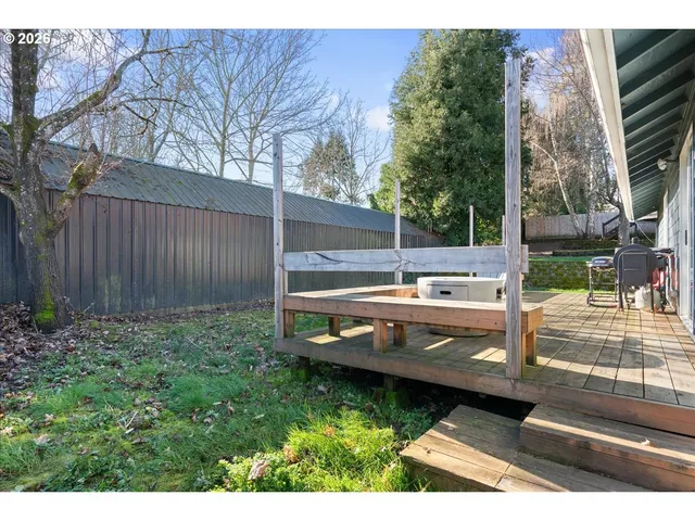 a view of a house with a backyard porch and sitting area