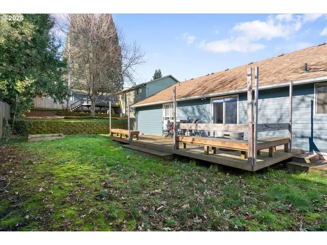 a view of backyard with seating area