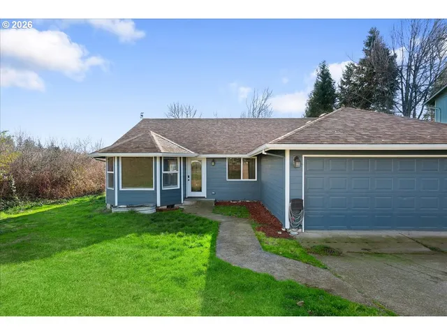a aerial view of a house with a yard