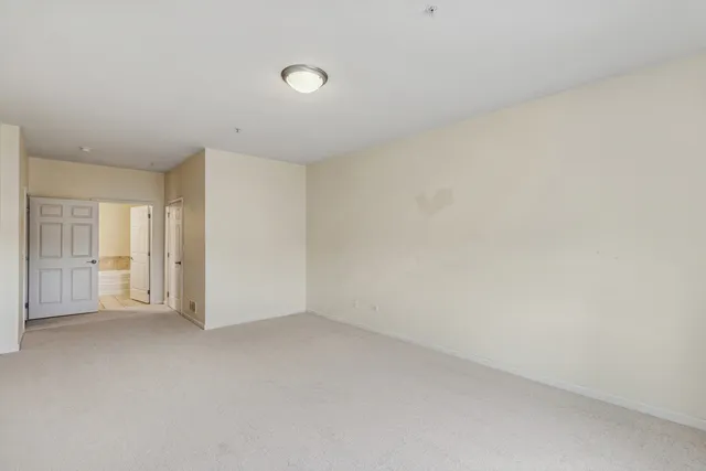 a view of an empty room and a window