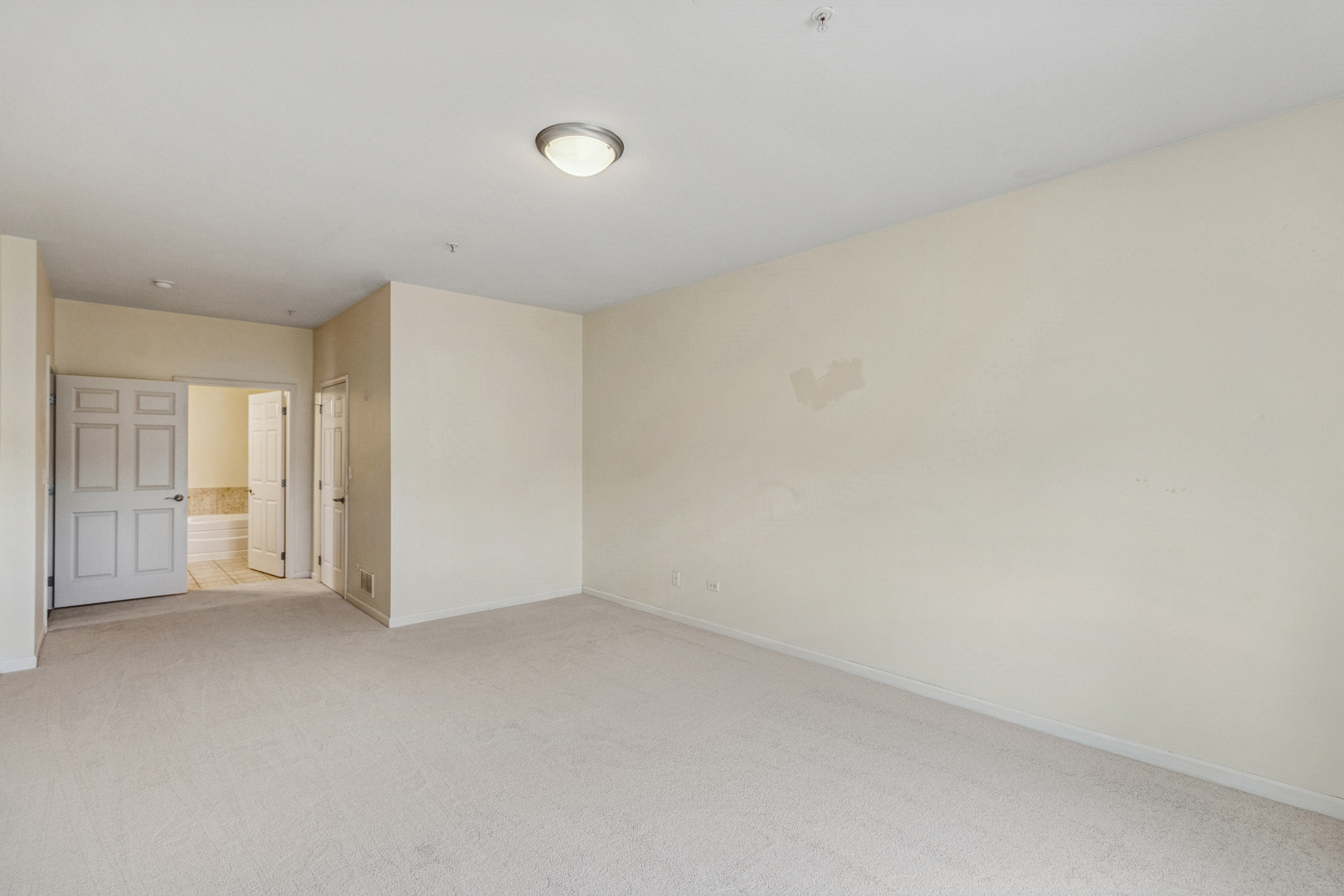 271 East Railroad Avenue, Unit 302 Bartlett, IL 60103 - Photo 15 of 21 a view of an empty room and a window