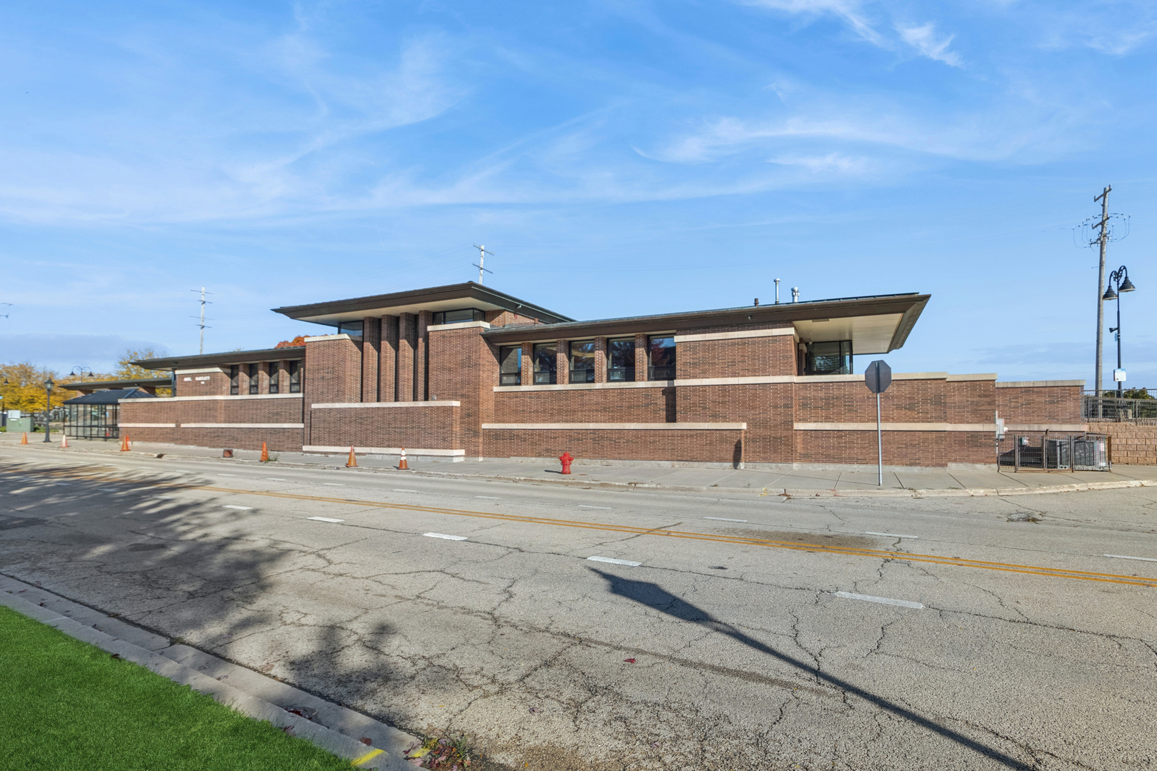 271 East Railroad Avenue, Unit 302 Bartlett, IL 60103 - Photo 20 of 21 a front view of a house with a yard