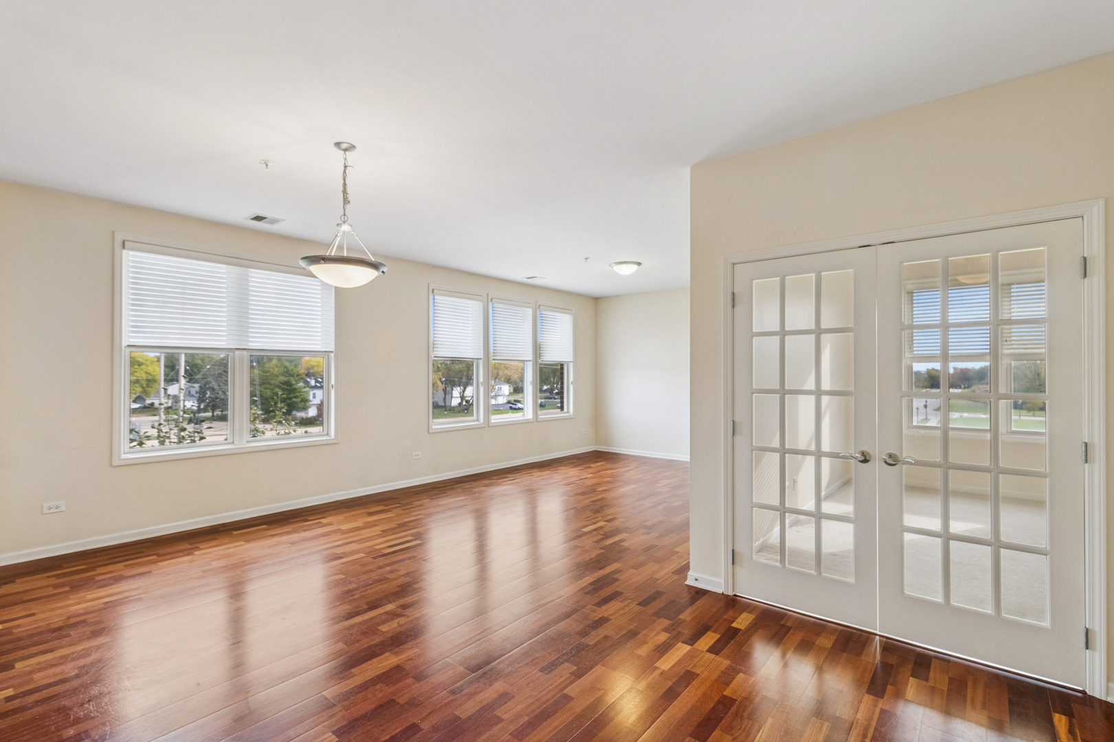 271 East Railroad Avenue, Unit 302 Bartlett, IL 60103 - Photo 4 of 21 a view of livingroom with furniture wooden floor and window