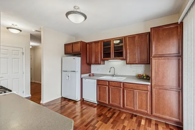 a kitchen with stainless steel appliances granite countertop a refrigerator sink and cabinets