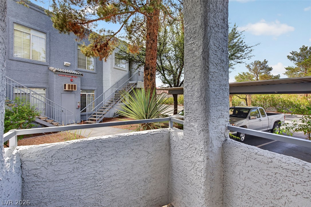 2201 Ramsgate Drive, Unit 1011 Henderson, NV 89074 - Photo 29 of 40 Multi-level living spaces offer private entries, framed by mature landscaping and convenient covered parking.