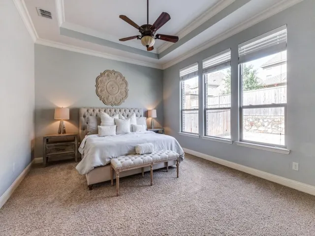 a bed room with a bed and a window