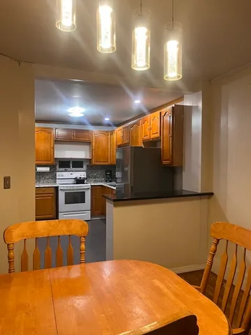 a kitchen with a sink cabinets and stainless steel appliances