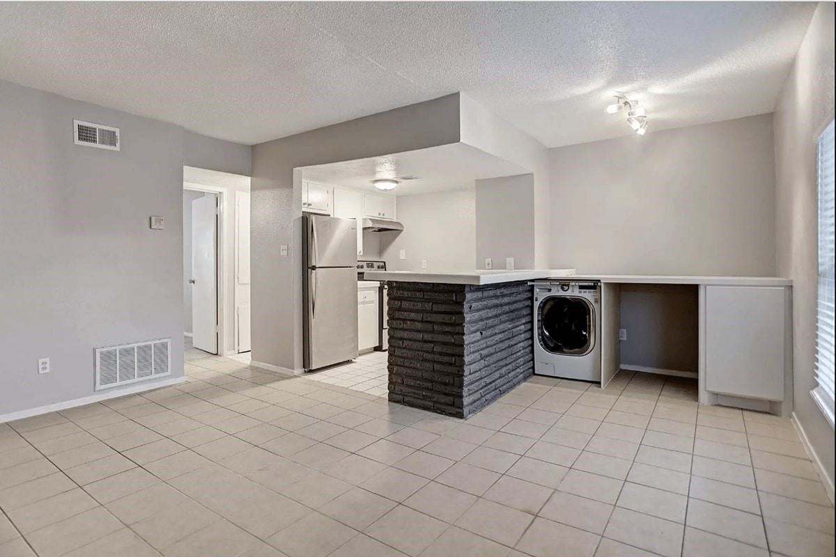 935 Byrne Street, Unit B23 Houston, TX 77009 - Photo 2 of 28 a kitchen with stainless steel appliances a sink and cabinets