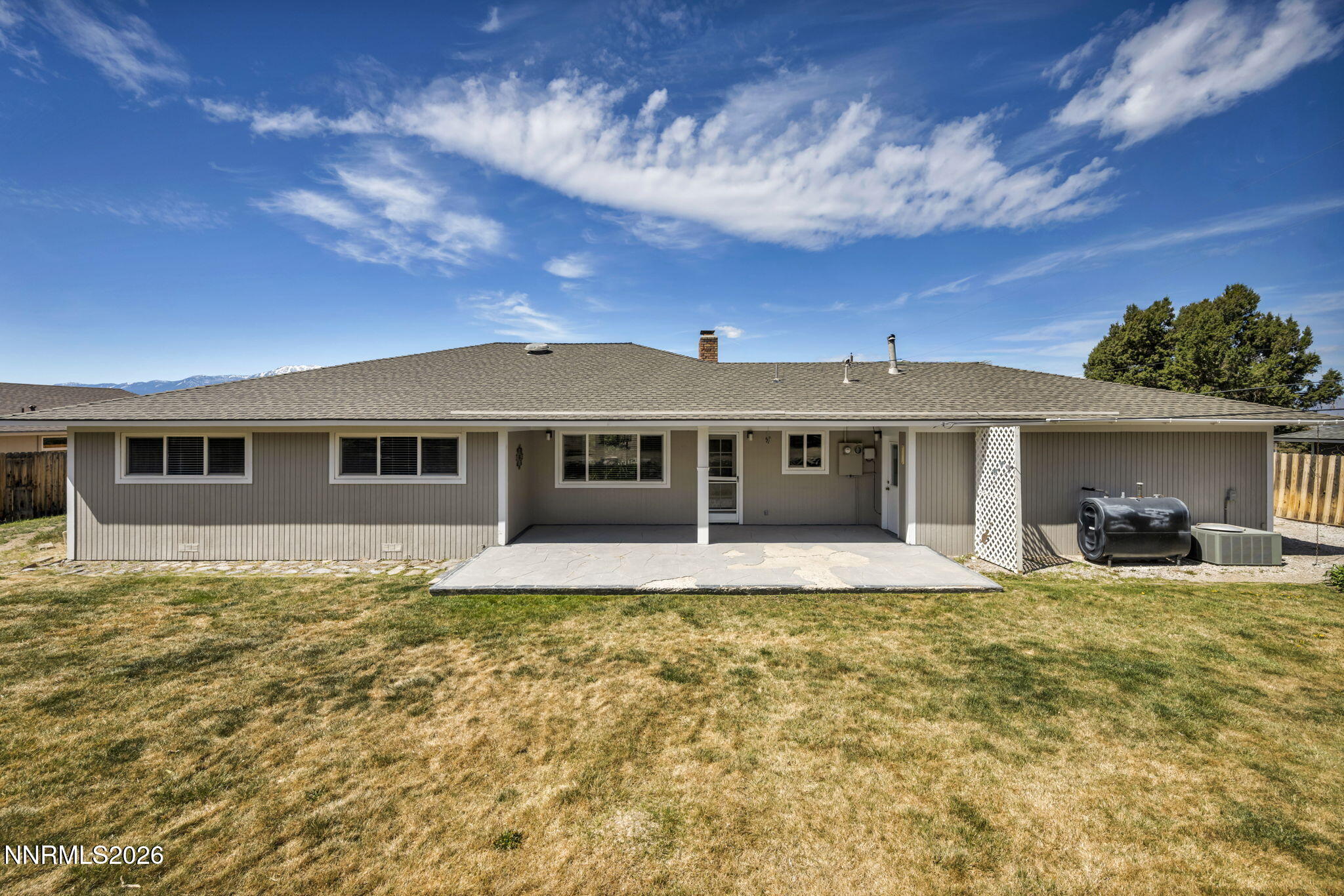 14190 Rim Rock Drive Reno, NV 89521 - Photo 50 of 68 a front view of a house with a yard
