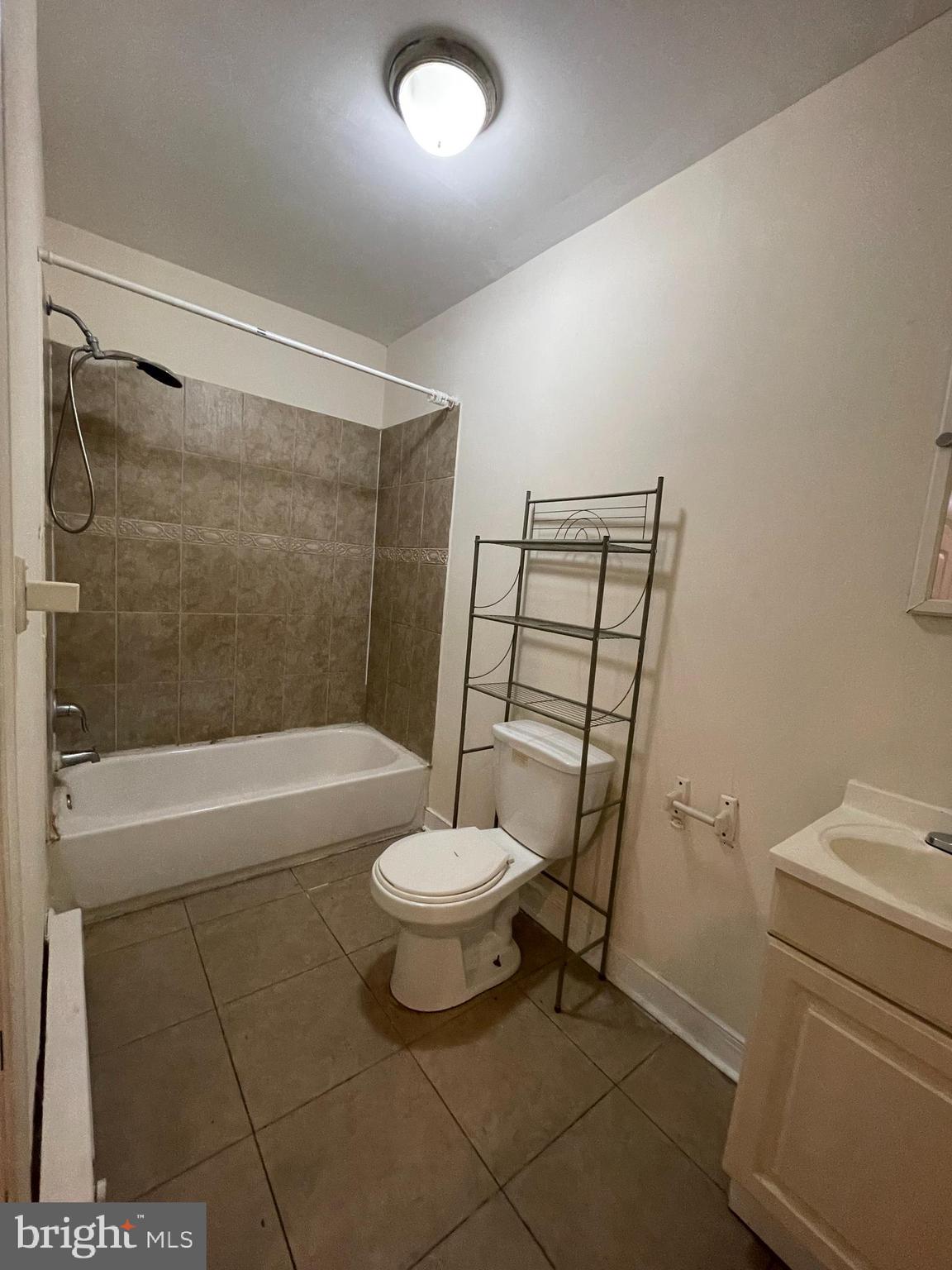 3427 North 2nd Street, Unit 2R Philadelphia, PA 19140 - Photo 4 of 5 a bathroom with a sink a toilet and a bathtub
