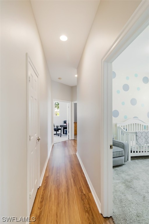 12893 Timber Ridge Drive Fort Myers, FL 33913 - Photo 11 of 30 a view of a hallway with wooden floor and furniture