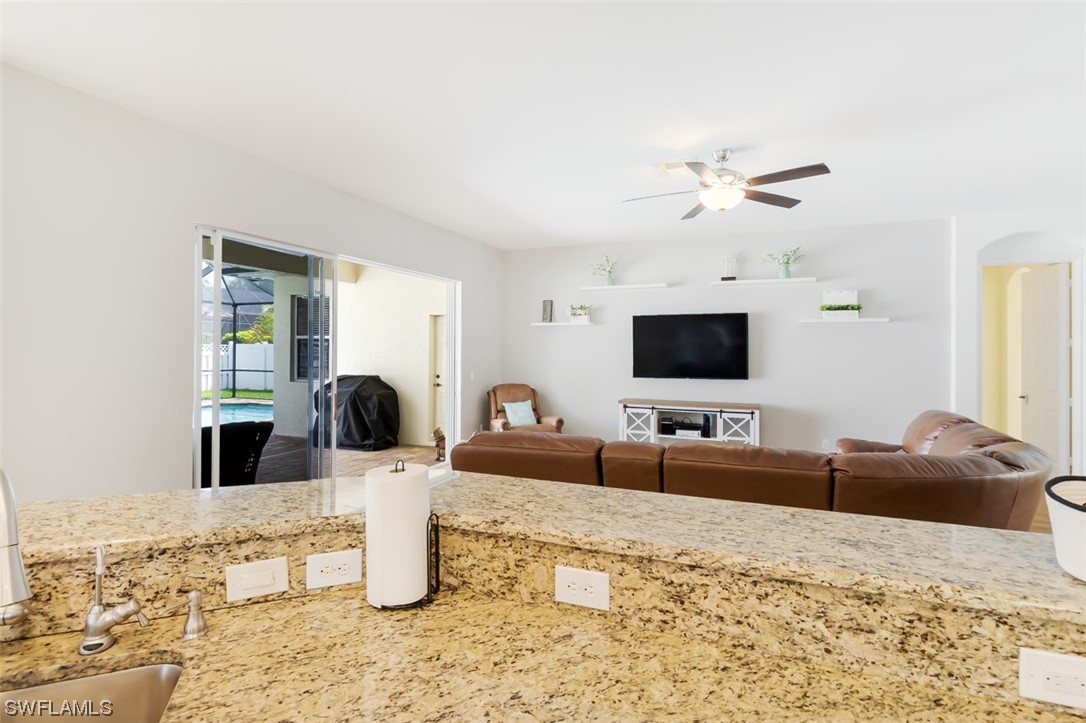 12893 Timber Ridge Drive Fort Myers, FL 33913 - Photo 18 of 30 a living room with furniture and a flat screen tv