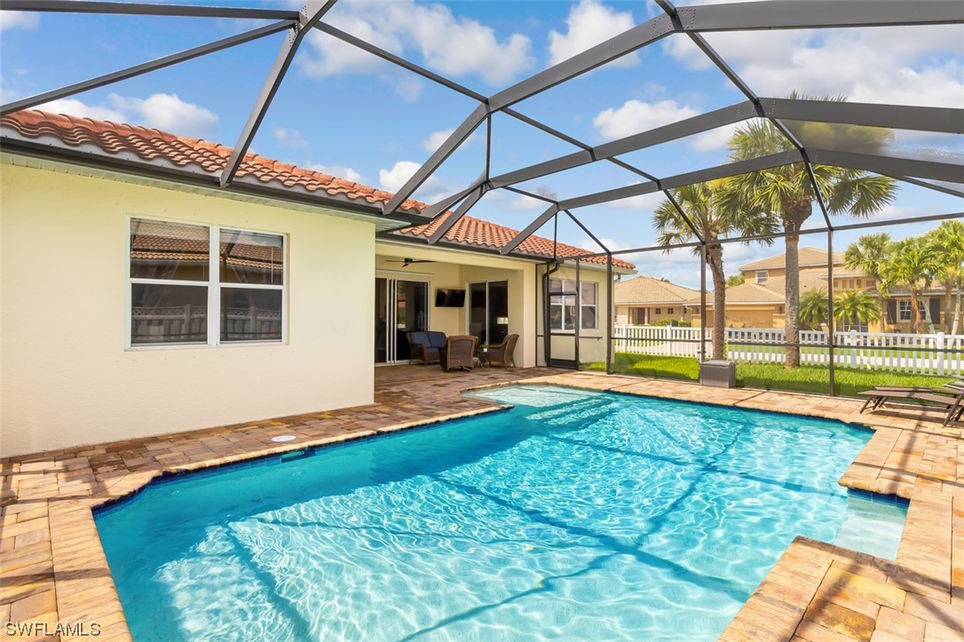 12893 Timber Ridge Drive Fort Myers, FL 33913 - Photo 24 of 30 a view of a backyard with a patio and a yard