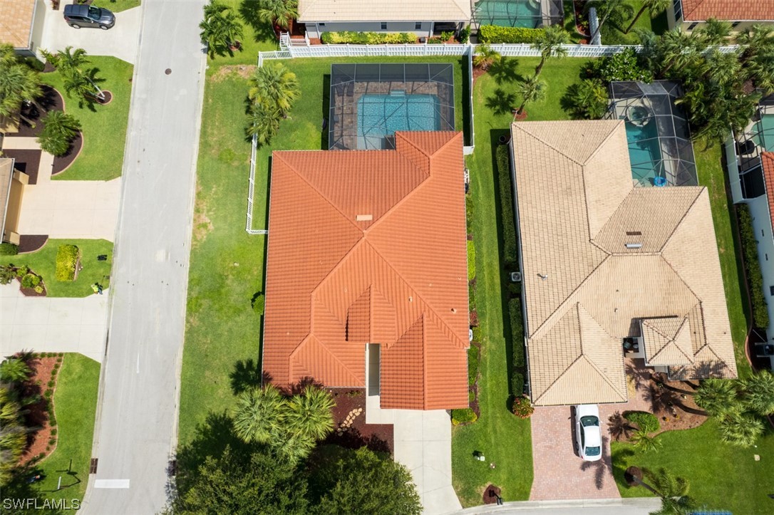 12893 Timber Ridge Drive Fort Myers, FL 33913 - Photo 29 of 30 an aerial view of a residential apartment building with a yard and potted plants