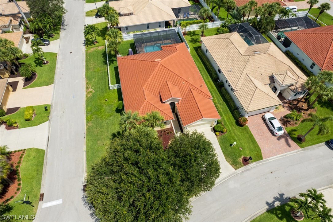 12893 Timber Ridge Drive Fort Myers, FL 33913 - Photo 30 of 30 an aerial view of a house with swimming pool and garden